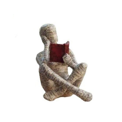 Reading Figurine Handcrafted Resin Newspaper Print