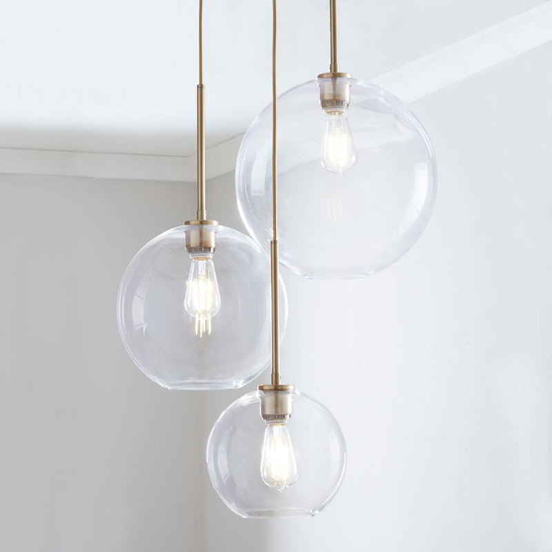 Elegant Glass Sphere Hanging Light in Chic Brass Finish